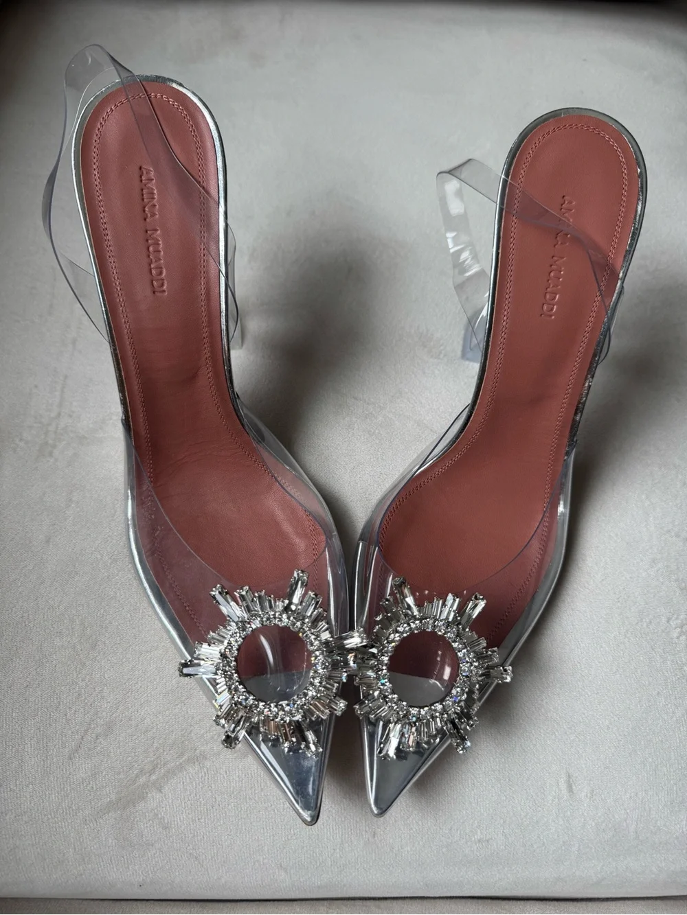Amina Muaddi Clear PVC Pointed Mule Heels with Silver Crystal Brooch